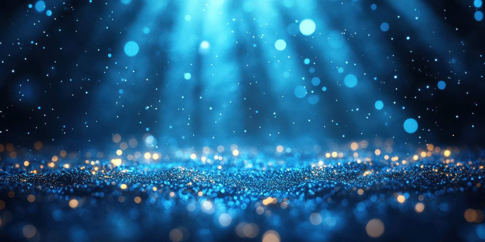 Captivating blue glitter particles illuminated by soft light create a dreamy atmosphere in a dark setting